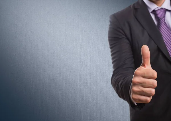 Business man mid section giving thumbs up against navy background — Stock Photo, Image