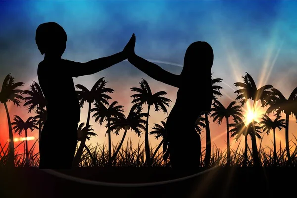 Silhouettes of  kids  against sunset view with palm trees — Stock Photo, Image