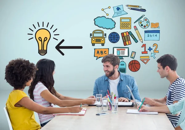 People at desk together with education ideas graphics drawings — Stock Photo, Image