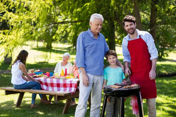 Grandfather, father and son barbequing — Stock Photo, Image