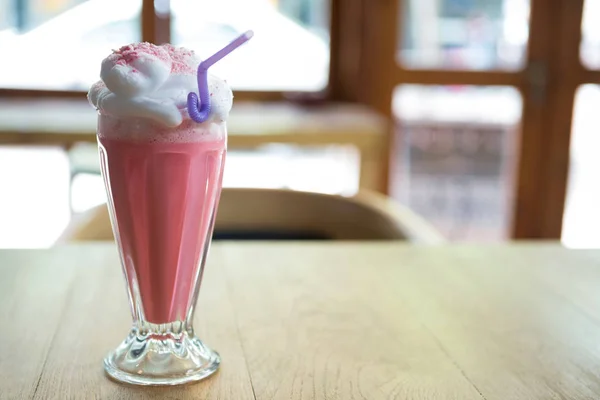 Glass of strawberry shake with cream — Stock Photo, Image