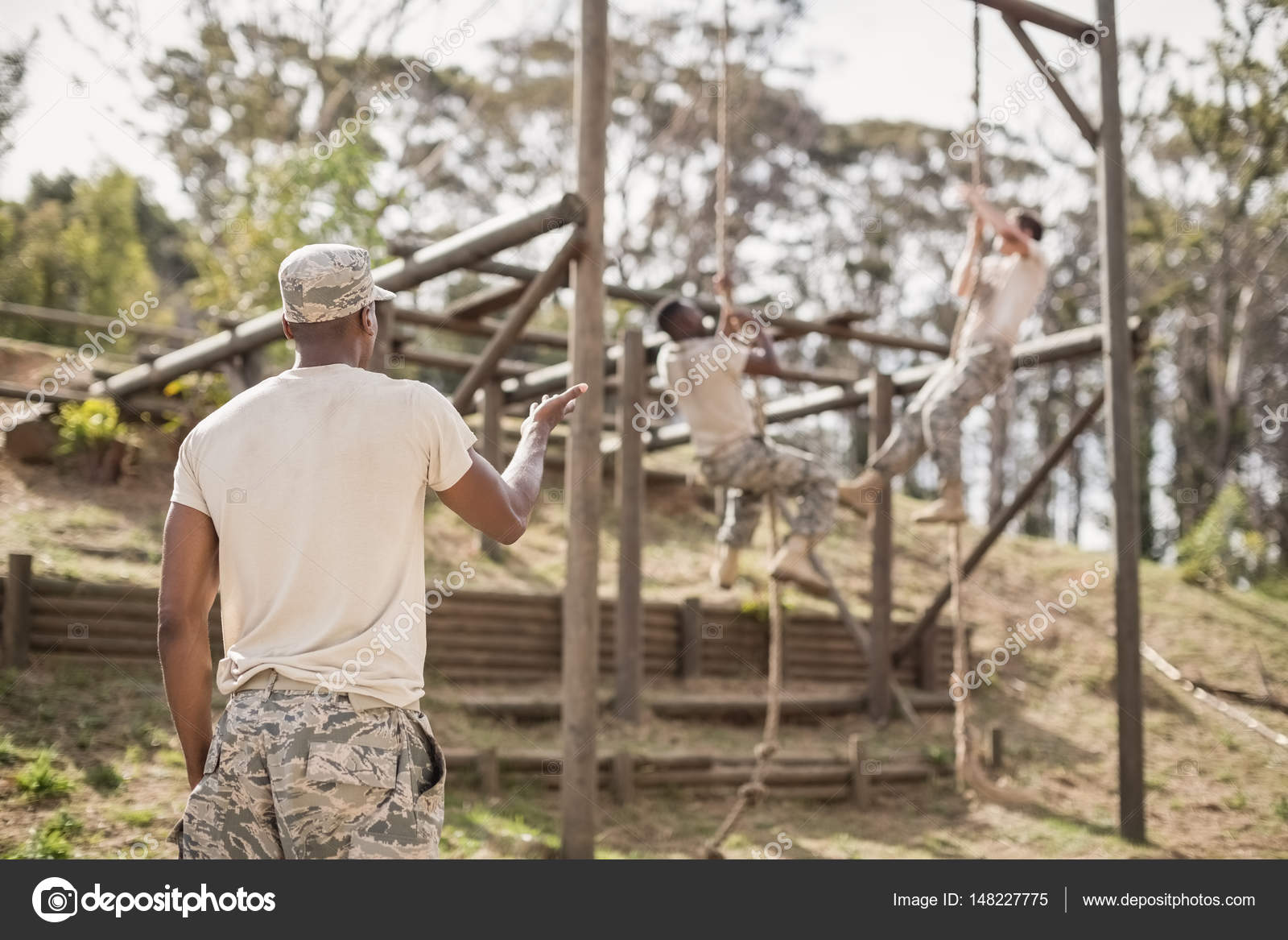 Military soldiers climbing rope — Stock Photo © Wavebreakmedia #148227775