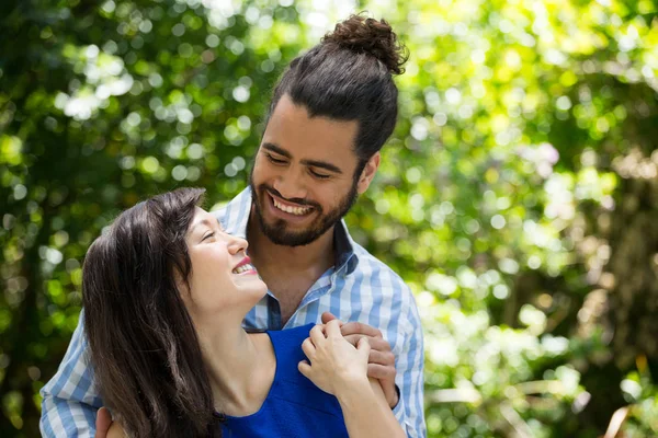Romantic couple looking at each other in park — Stock Photo, Image