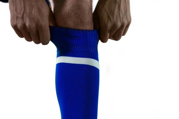 Football player pulling his socks up — Stock Photo, Image