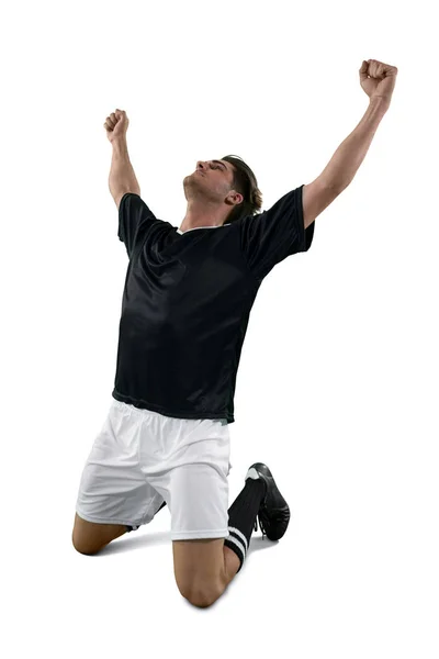 Jogador de futebol comemorando sua vitória — Fotografia de Stock