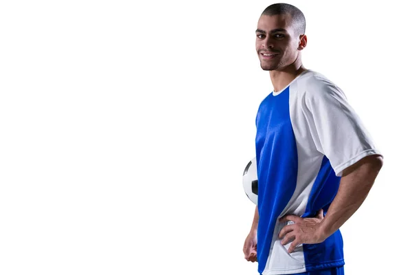 Smiling football player holding football — Stock Photo, Image