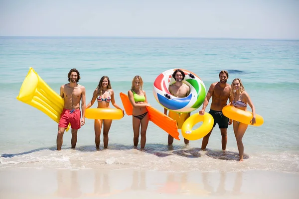 Friends with inflatable rings and pool rafts — Stock Photo, Image