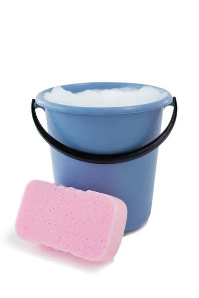 Sponge by bucket containing soap sud — Stock Photo, Image