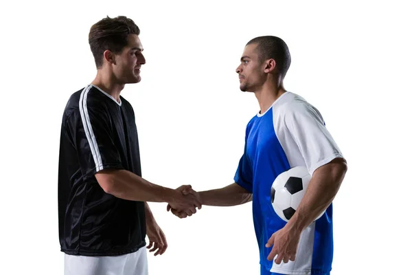 Due giocatori di calcio che si stringono la mano — Foto Stock