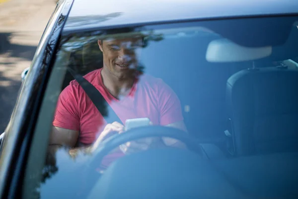 Young man driving car — Stock Photo, Image