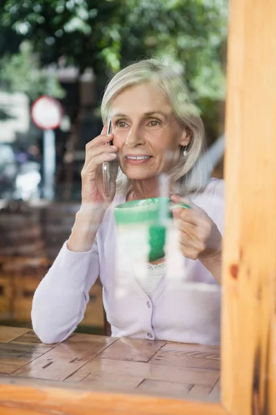 Senior woman drinking coffee — Stock Photo, Image