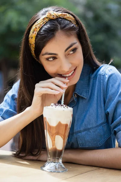 Happy woman drinking cold coffee — Stock Photo, Image