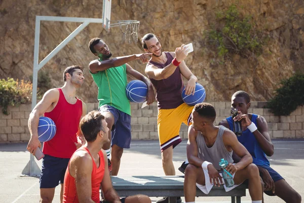 Basketball players taking a selfie — Stock Photo, Image