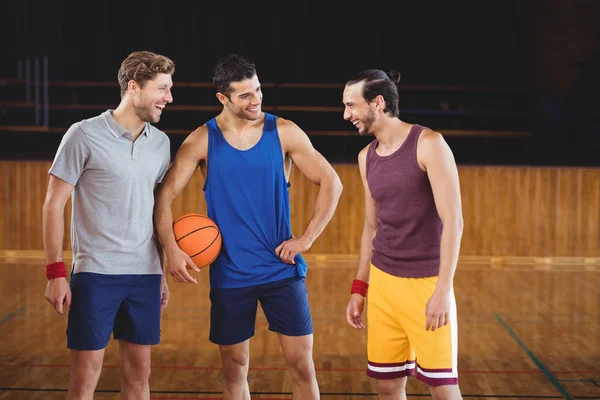 Male basketball players laughing — Stock Photo, Image