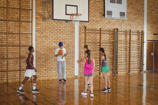 Coach guiding high school kids — Stock Photo, Image