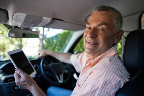 Portrait of senior man using digital tablet — Stock Photo, Image