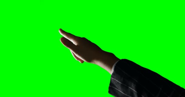 Persona haciendo gesto de mano contra fondo de pantalla verde — Vídeos de Stock