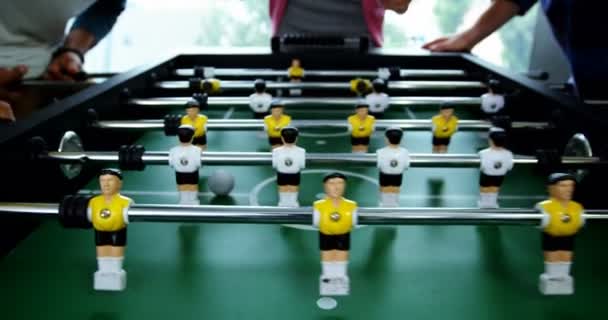 Happy graphic designers playing table football — Stock Video