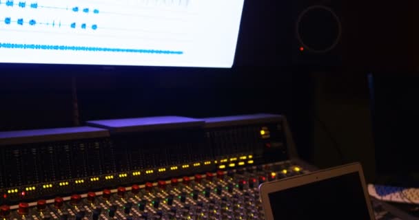 Audio engineers using laptop while mixing sound — Stock Video