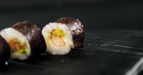 Maki sushi on black background — Stock Video