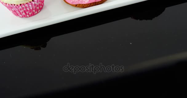 Close-up of delicious cupcake in tray — Stock Video