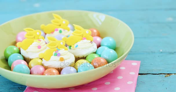 Easter eggs with cup cakes — Stock Video