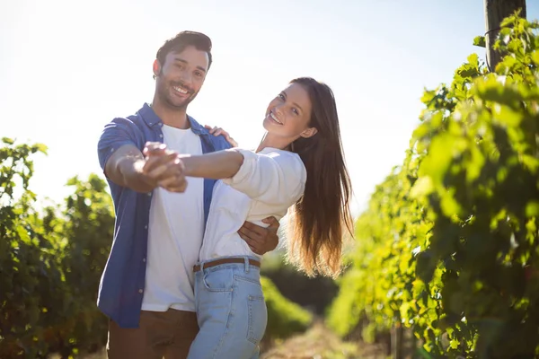 Young couple dancing at vineyard — Stock Photo, Image