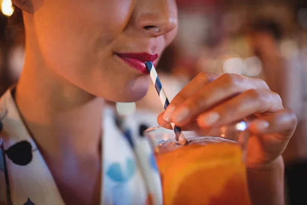 Woman having cocktail drink — Stock Photo, Image