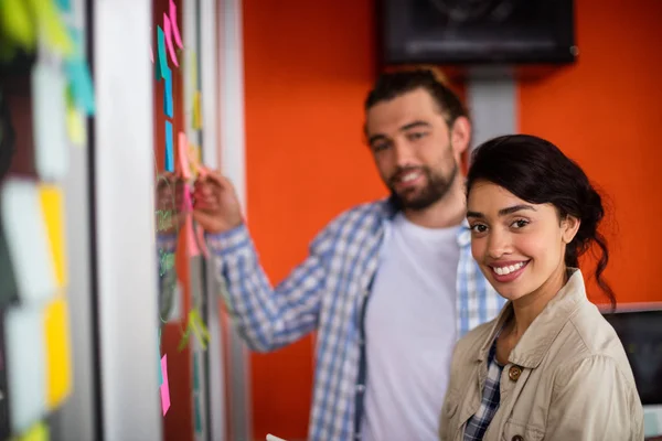 Smiling male and female executives — Stock Photo, Image