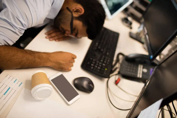 Tired businessman sleeping at desk — Stock Photo, Image