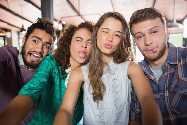 Friends making face in restaurant — Stock Photo, Image