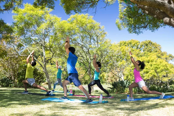 Group of people performing stretching exercise — Stock Photo, Image