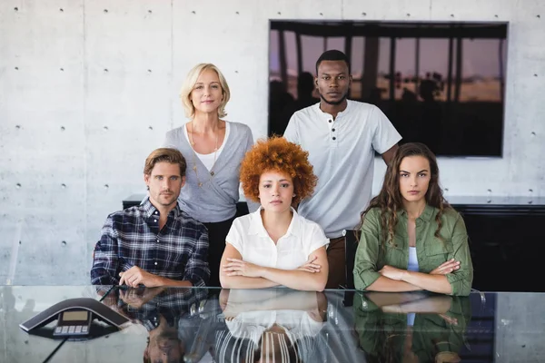 Confident colleagues at desk — Stock Photo, Image