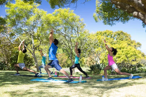Group of people performing stretching exercise — Stock Photo, Image
