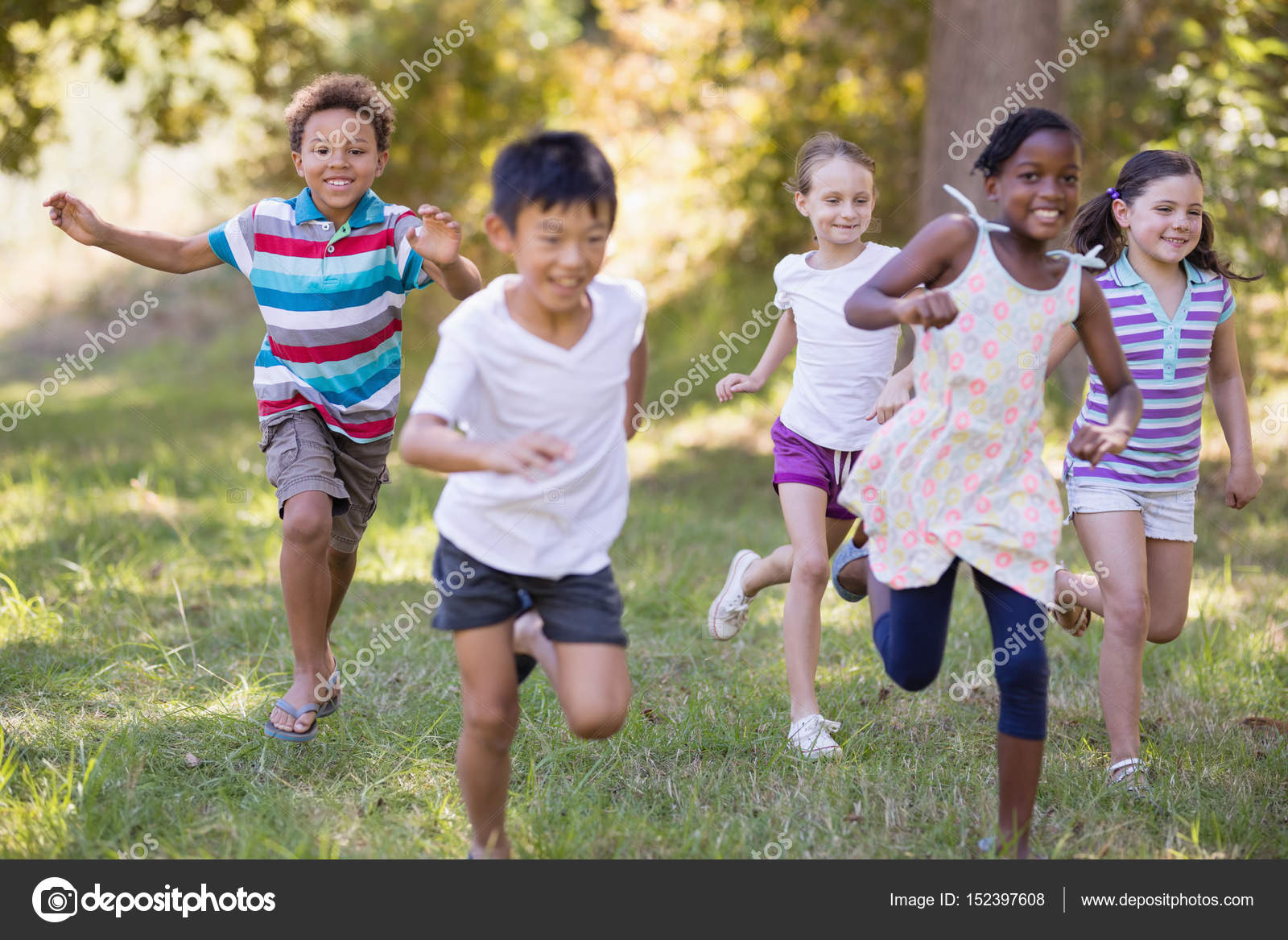 Happy friends running at campsite — Stock Photo © Wavebreakmedia 152397608
