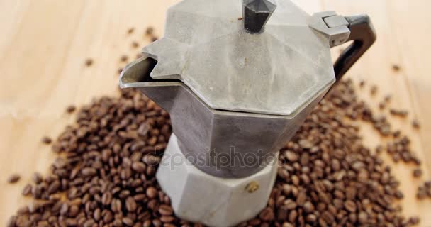 Coffee beans with metallic coffeemaker — Stock Video