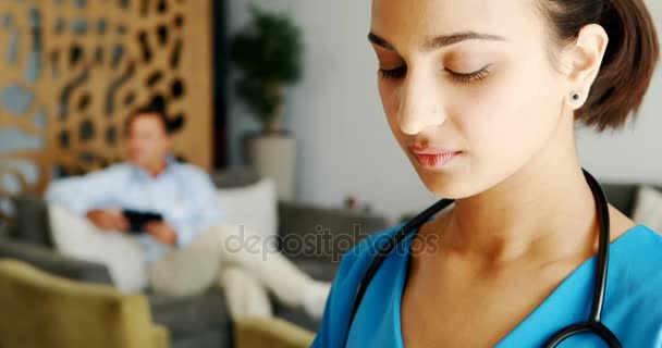 Portrait of smiling female doctor — Stock Video