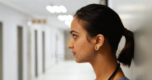 Portrait of female doctor standing in corridor — Stock Video