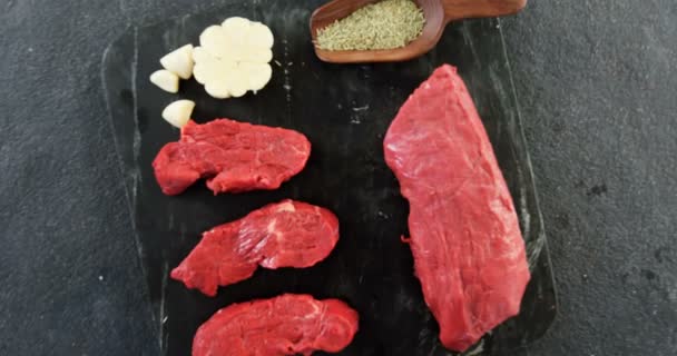 Raw meat and ingredients on the board — Stock Video