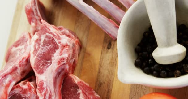 Beef rib chops and ingredients on wooden floor — Stock Video