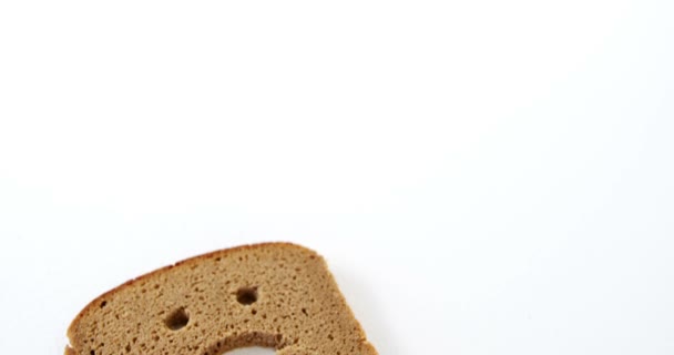 Sad face on bread slice — Stock Video