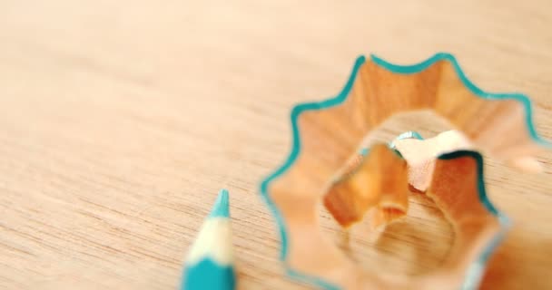 Close-up of green colored pencil with shavings — Stock Video