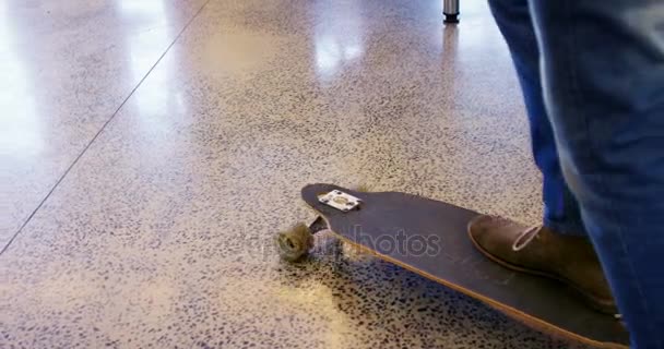 Executive skateboarding in office — Stock Video