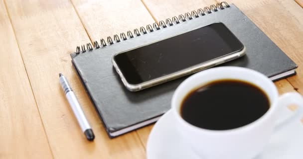 Coffee with organizer and mobile phone — Stock Video