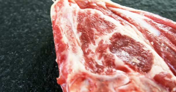 Sirloin chop on concrete background — Stock Video