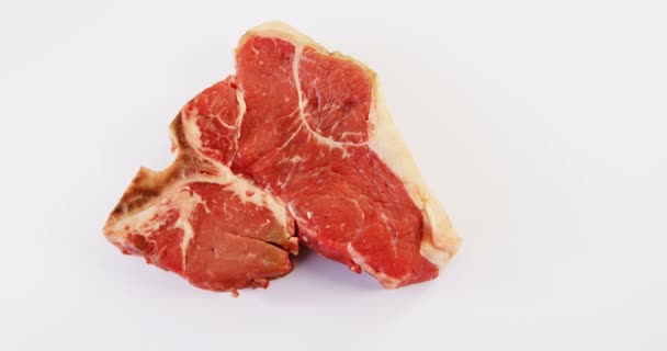 Raw steak on white background — Stock Video