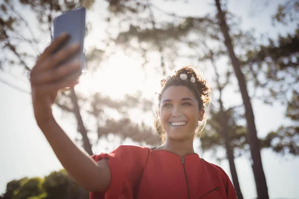 Woman taking selfie at forest — Stock Photo, Image