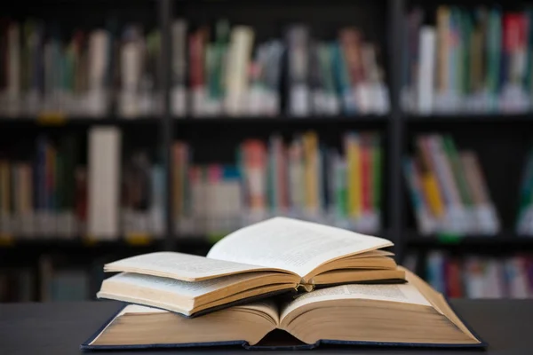 Open books on table — Stock Photo, Image