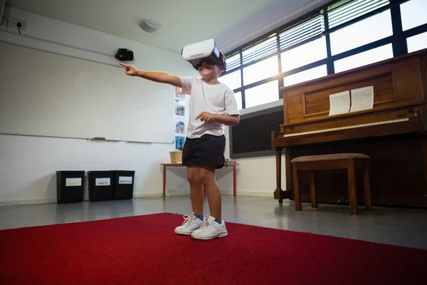 Boy wearing virtual reality simulator dancing — Stock Photo, Image