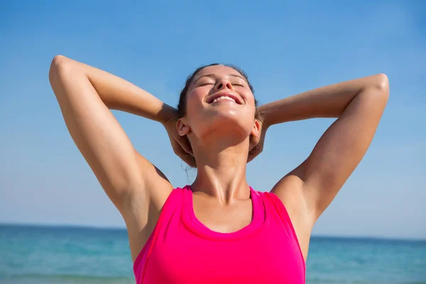 Young woman exercising at beach Royalty Free Stock Images